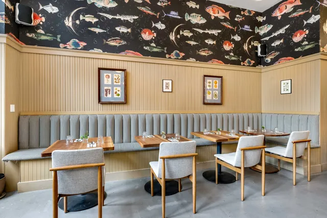 a view of a chairs and table in a room