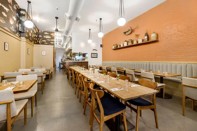 a view of a dining area with furniture and a chandelier