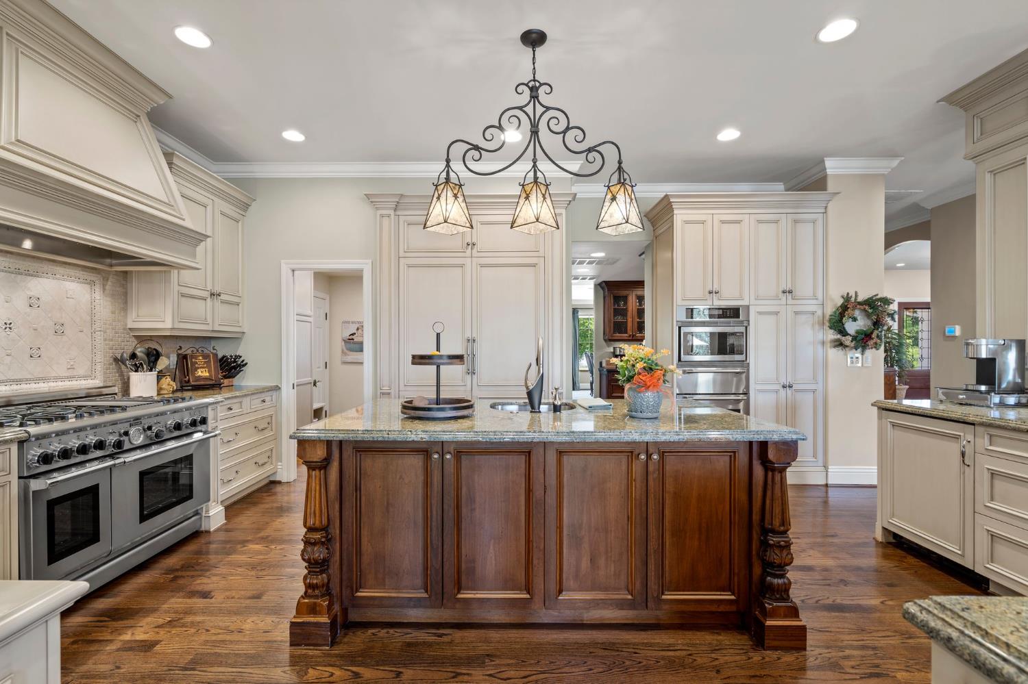 10676 Wilton Road Elk Grove, CA 95624 - Photo 29 of 71 a kitchen with stainless steel appliances a stove top oven and a refrigerator