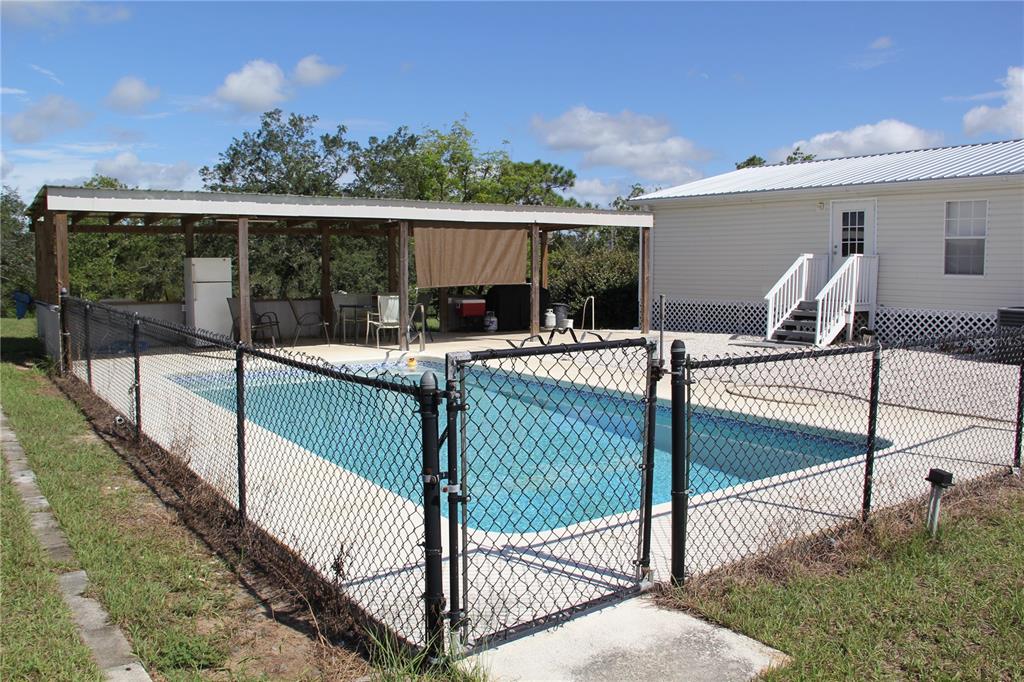 13127 Star Road Brooksville, FL 34613 - Photo 13 of 54 a view of a balcony and yard