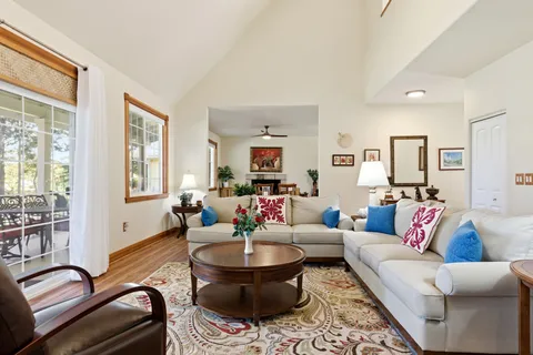 a living room with furniture and windows