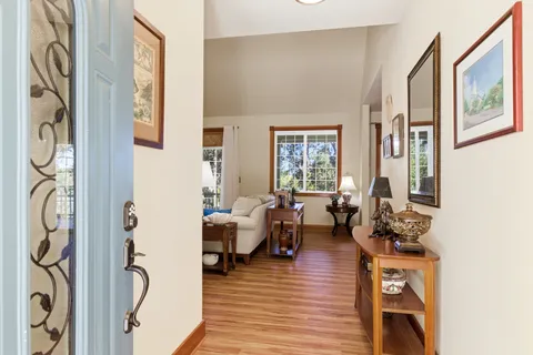 a living room with furniture or window and a wooden floor