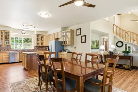 a view of a dining room with furniture and wooden floor