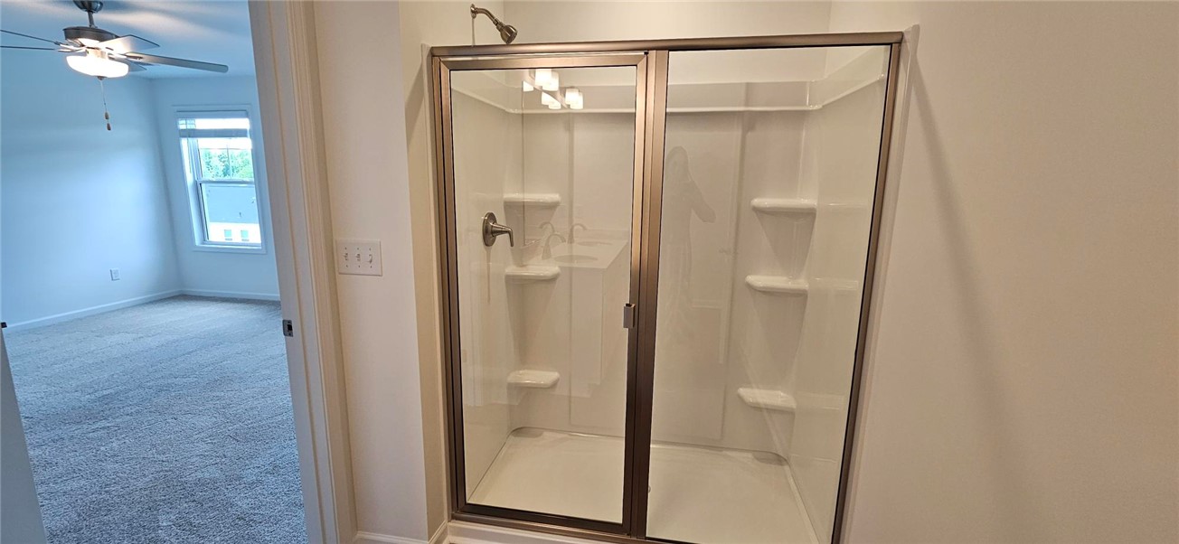 409 Belgrove Way Easley, SC 29640 - Photo 9 of 15 This spacious bathroom offers a convenient shower, perfect for daily routines.