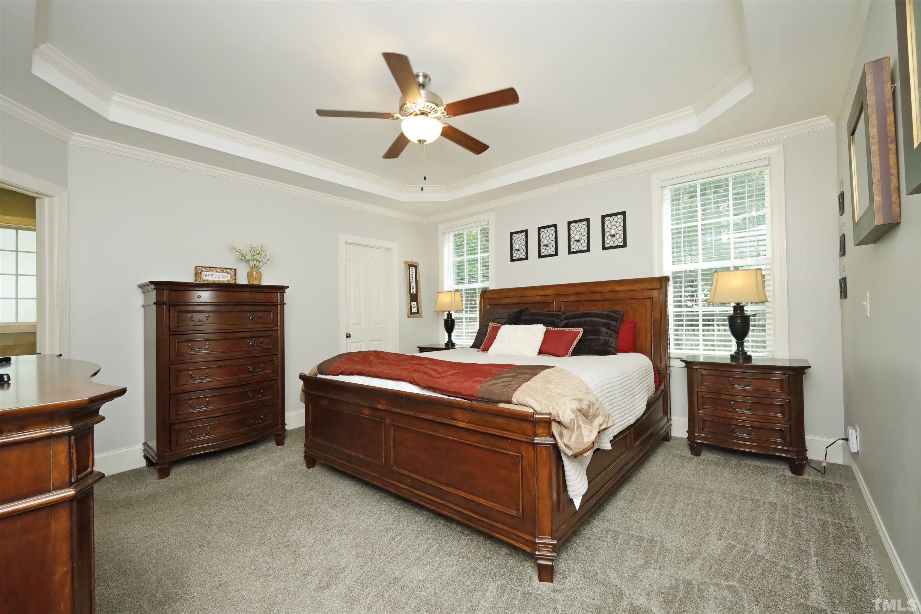 3630 Pine Needles Drive Wake Forest, NC 27587 - Photo 24 of 47 a bed room with a bed and a ceiling fan