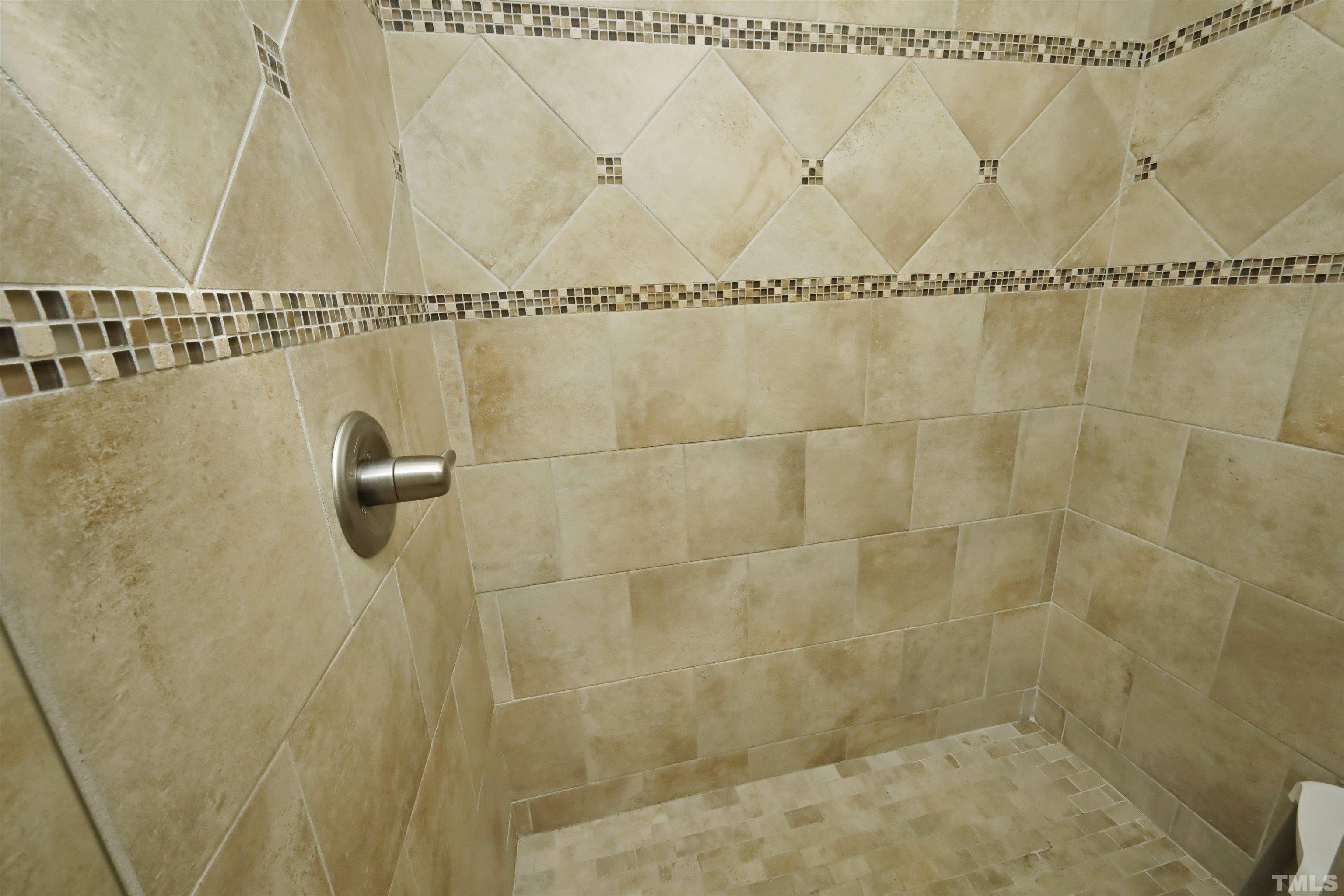 3630 Pine Needles Drive Wake Forest, NC 27587 - Photo 27 of 47 a bathroom with a shower