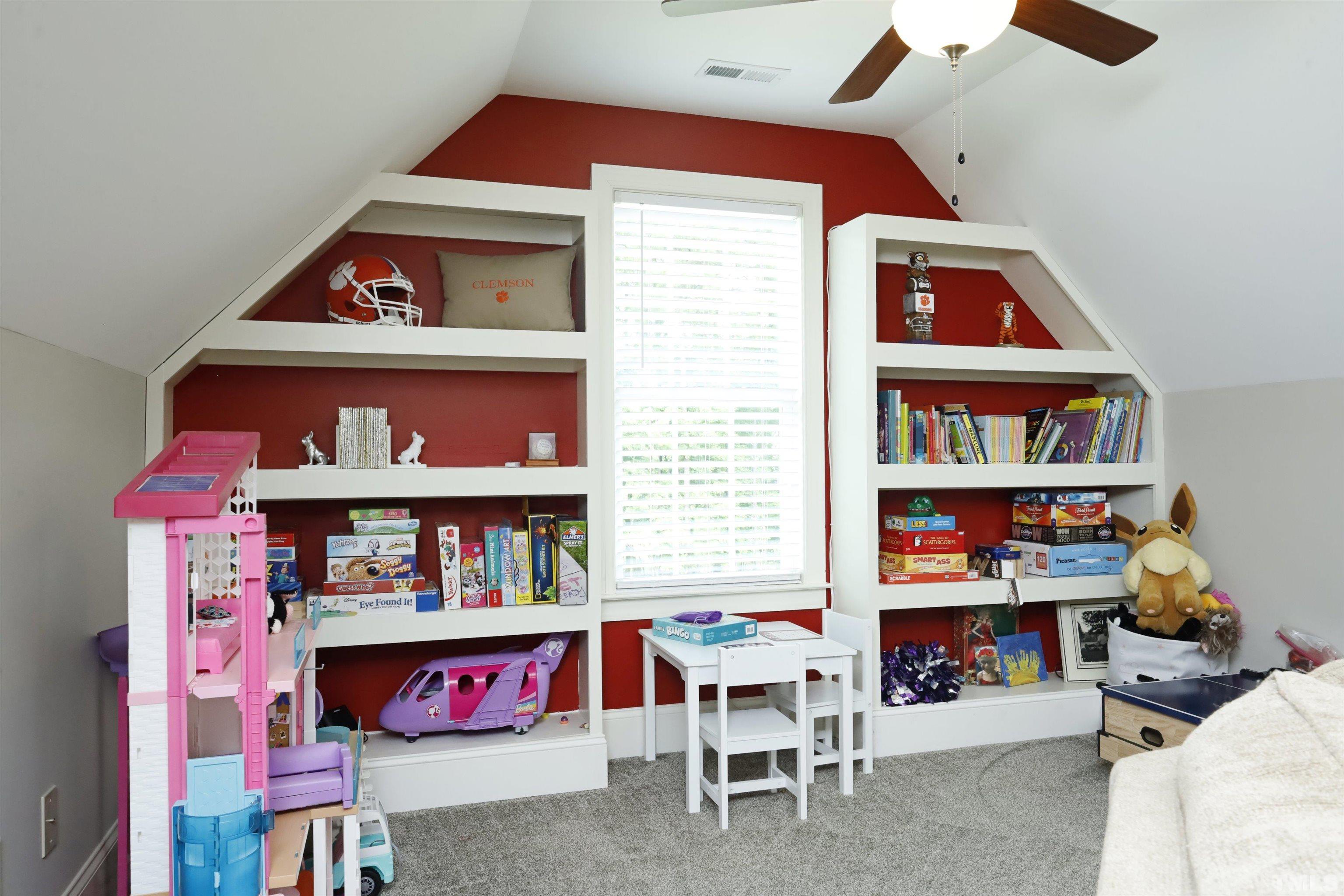 3630 Pine Needles Drive Wake Forest, NC 27587 - Photo 30 of 47 a room with furniture and a book shelf