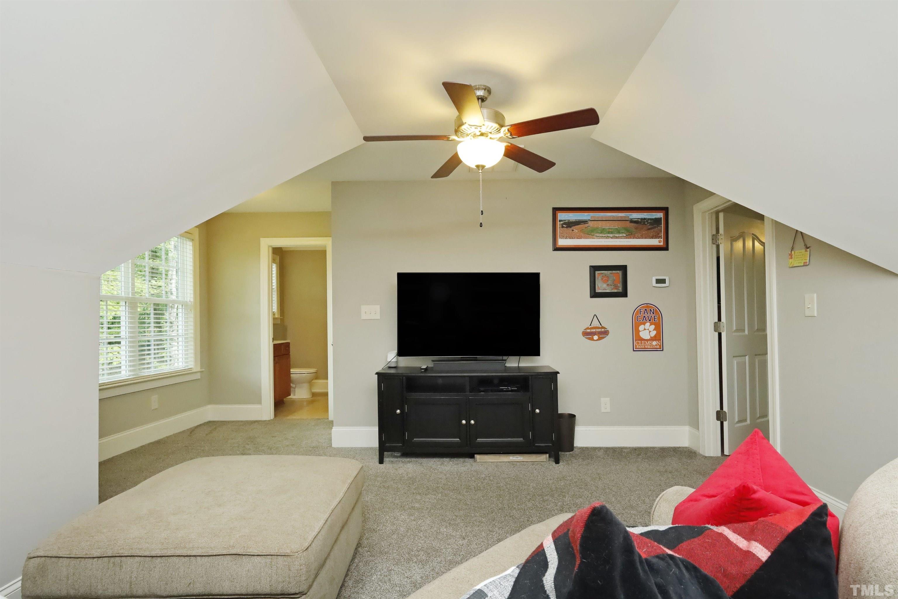 3630 Pine Needles Drive Wake Forest, NC 27587 - Photo 31 of 47 a living room with furniture and a flat screen tv