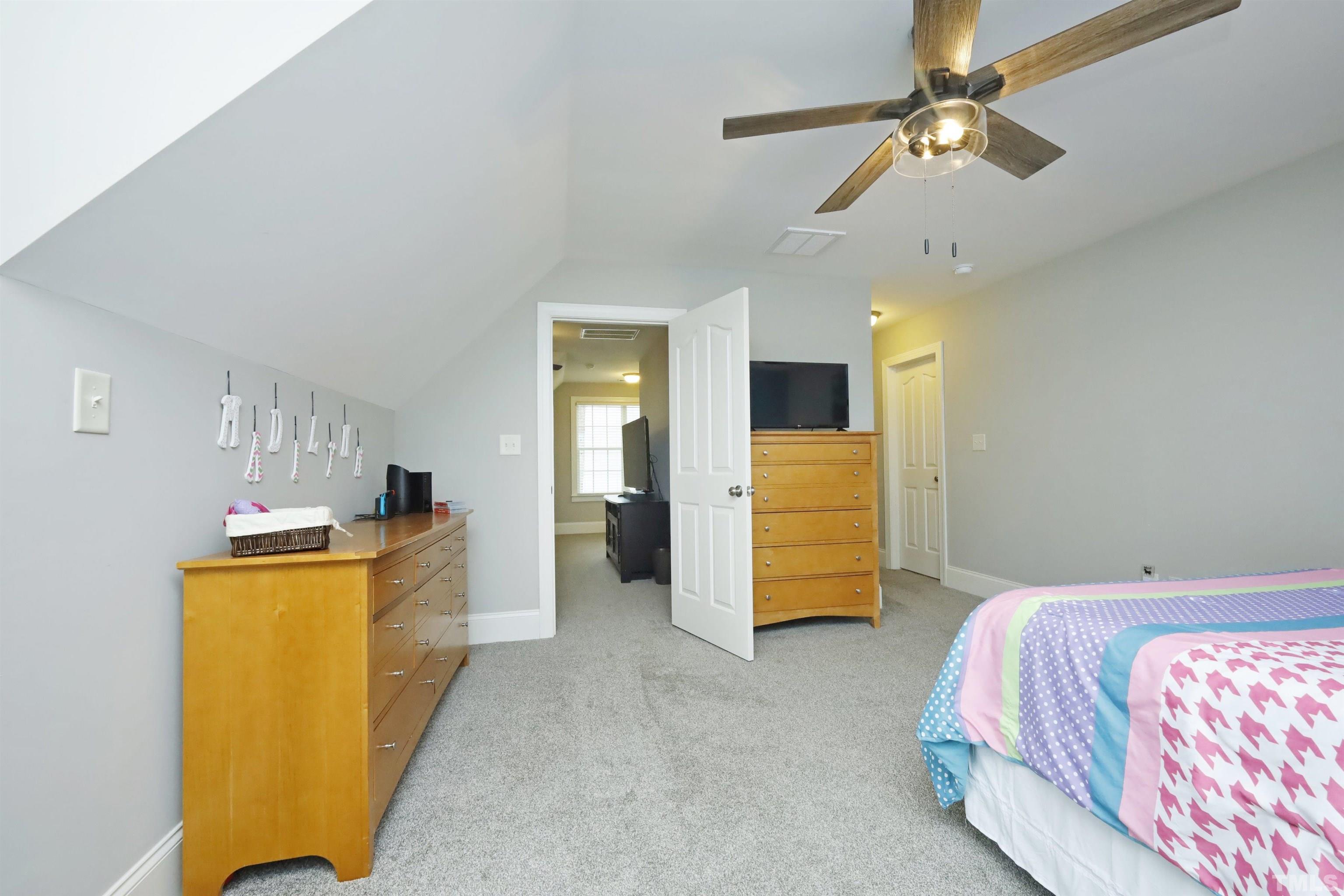 3630 Pine Needles Drive Wake Forest, NC 27587 - Photo 33 of 47 a bedroom with a bed and ceiling fan