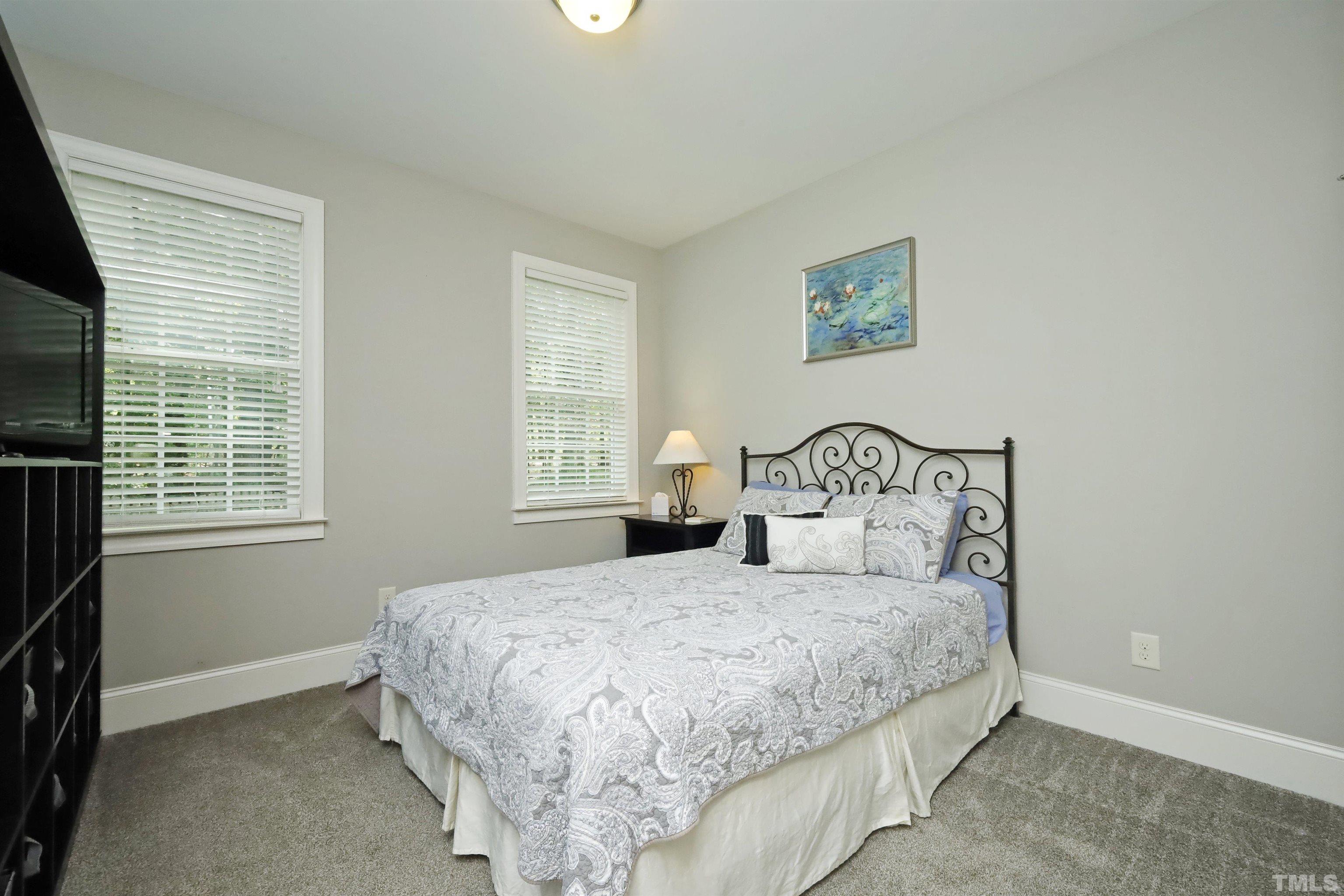3630 Pine Needles Drive Wake Forest, NC 27587 - Photo 35 of 47 a bedroom with a bed and a window