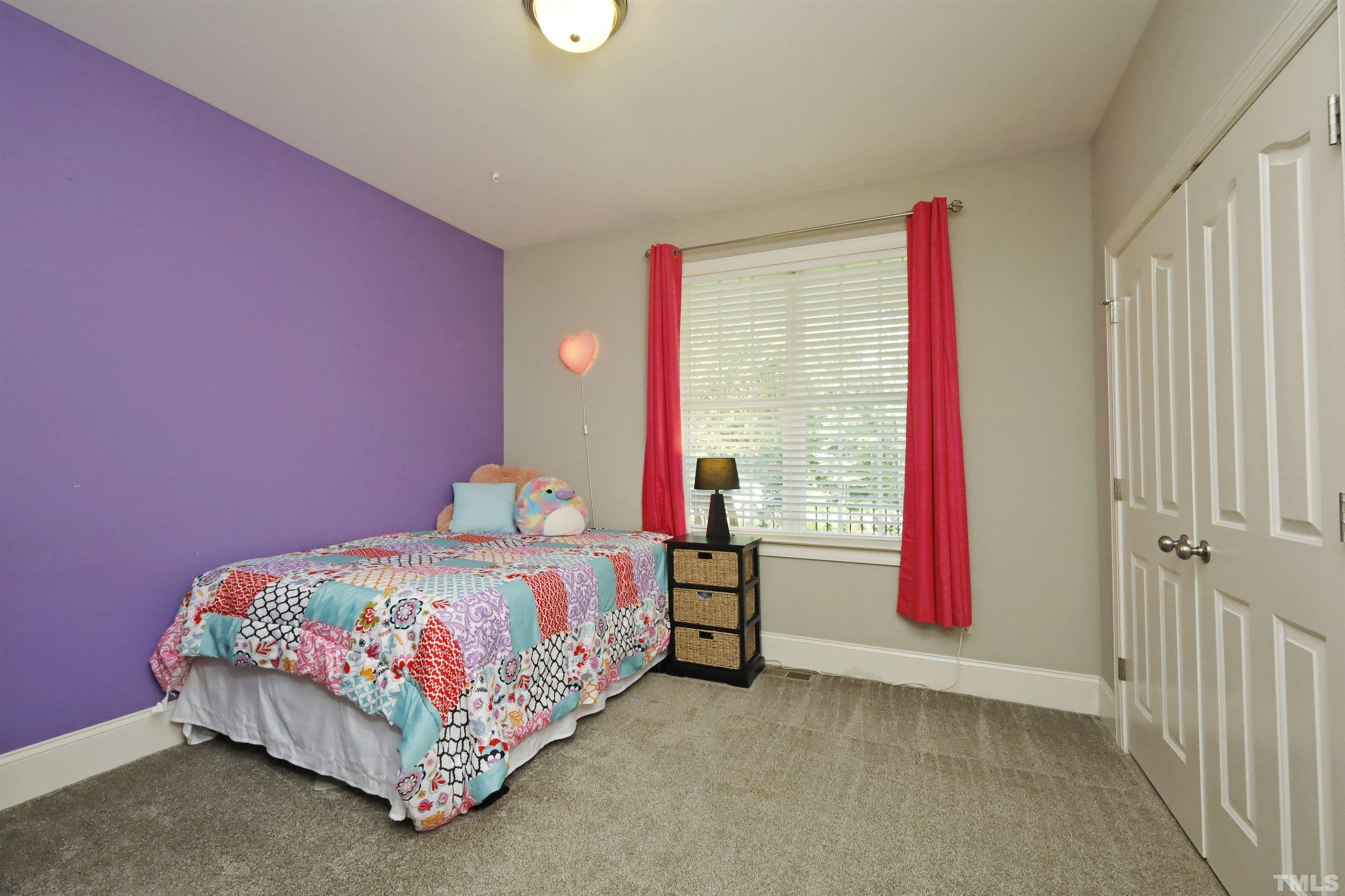 3630 Pine Needles Drive Wake Forest, NC 27587 - Photo 36 of 47 a bedroom with a bed and a window