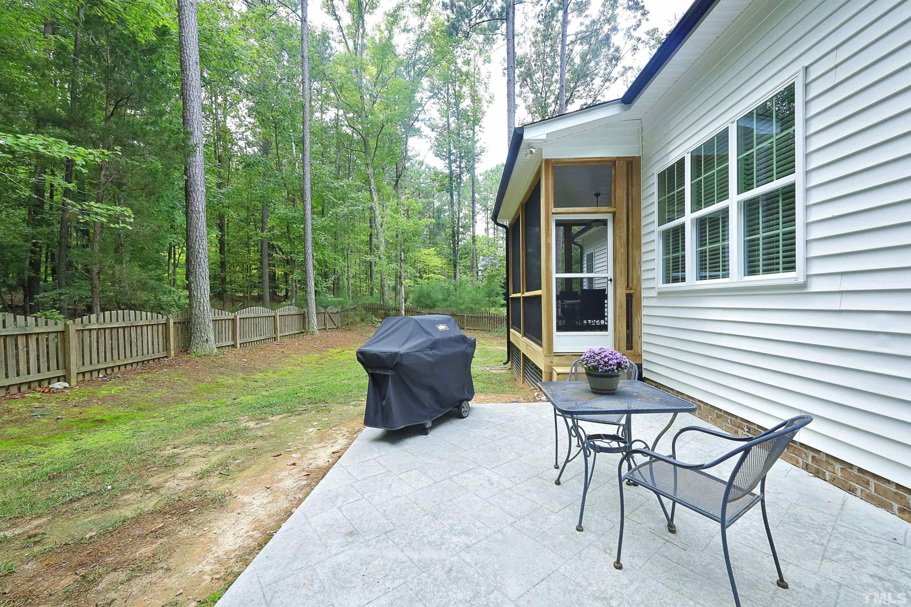 3630 Pine Needles Drive Wake Forest, NC 27587 - Photo 39 of 47 a view of a backyard with table and chairs