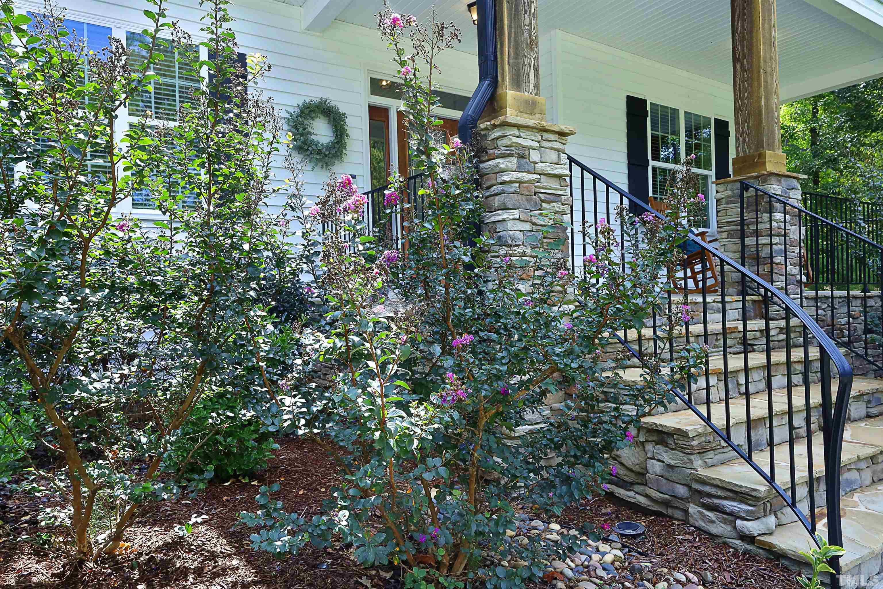3630 Pine Needles Drive Wake Forest, NC 27587 - Photo 4 of 47 a view of a house with a flower garden
