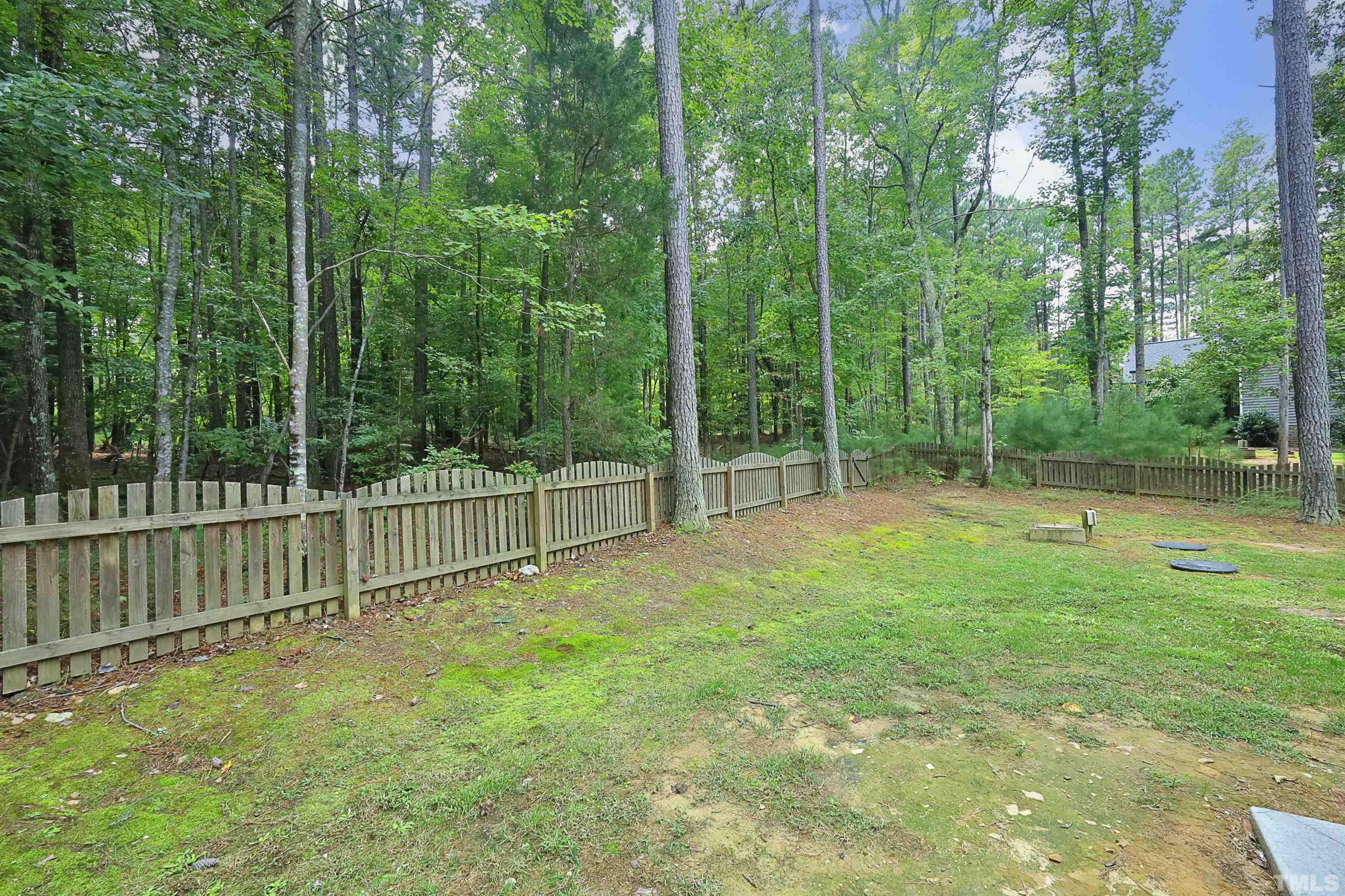3630 Pine Needles Drive Wake Forest, NC 27587 - Photo 42 of 47 a view of a backyard with fence