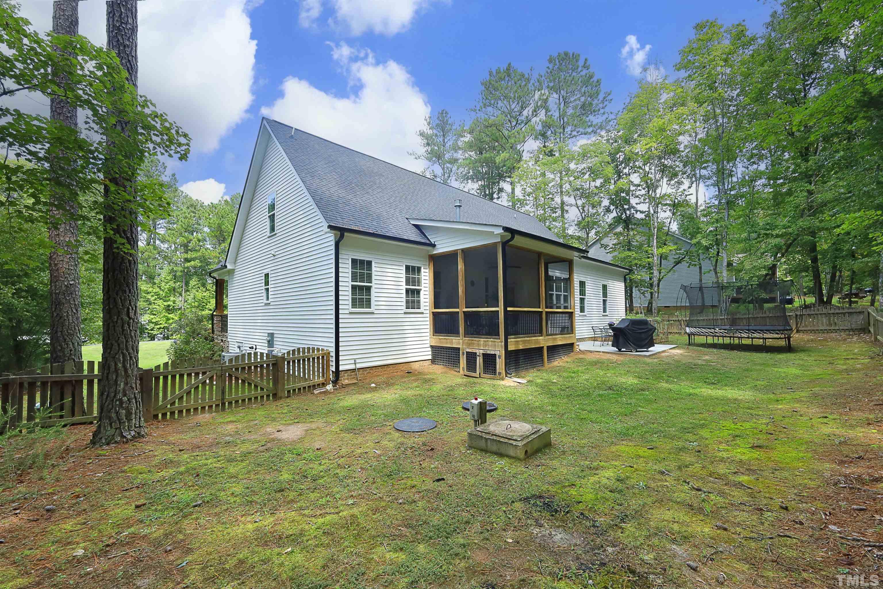 3630 Pine Needles Drive Wake Forest, NC 27587 - Photo 43 of 47 a view of a house with backyard and a tree