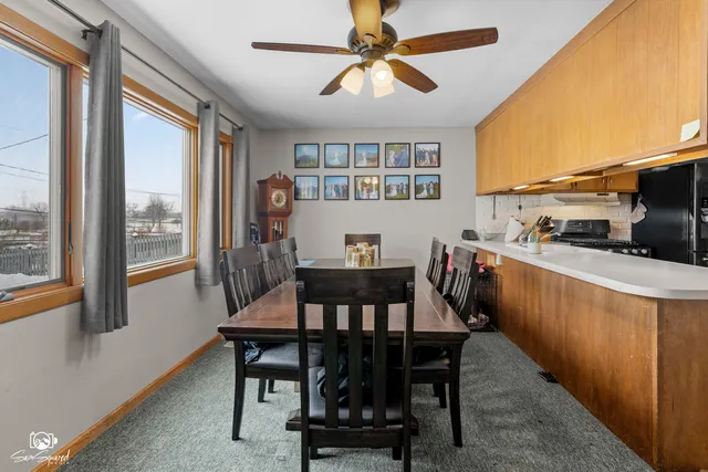 a kitchen with granite countertop stainless steel appliances and wooden cabinets