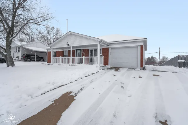 a view of a house with a snow in the yard
