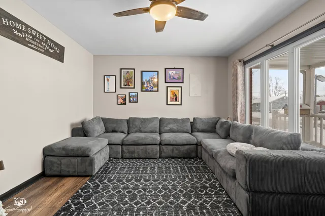 a living room with furniture cabinets and window