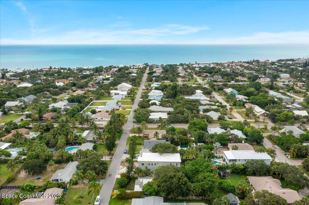 407 3rd Avenue Melbourne Beach, FL 32951 - Photo 10 of 14 an aerial view of residential building with green space