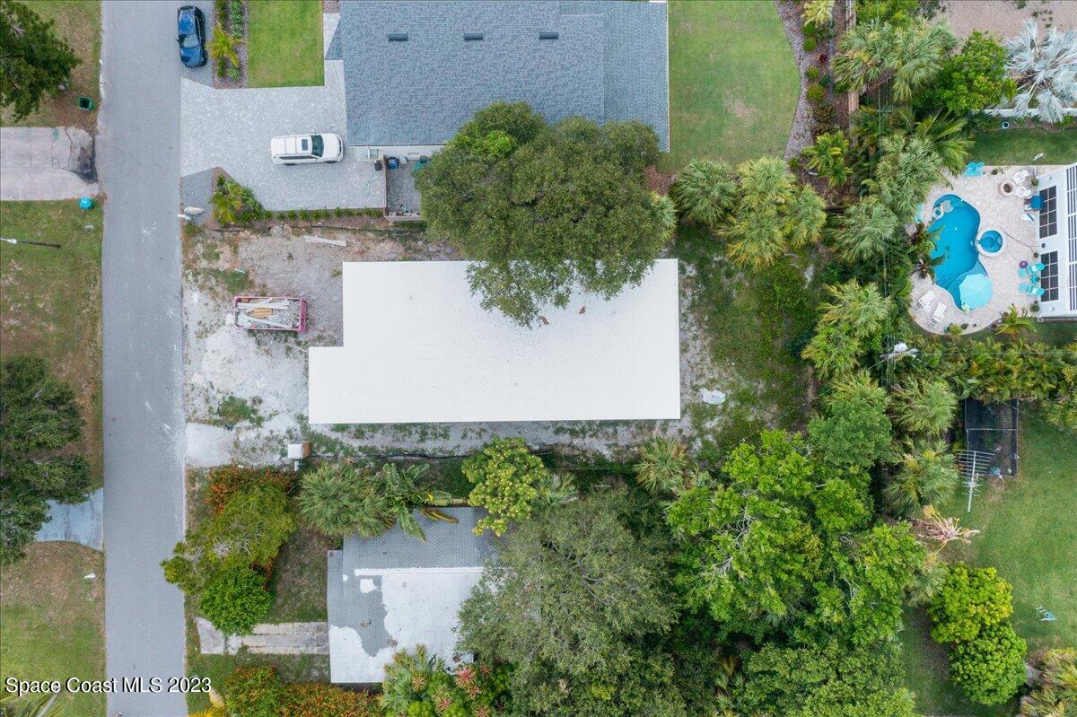 407 3rd Avenue Melbourne Beach, FL 32951 - Photo 7 of 14 an aerial view of a house with a yard and lake view