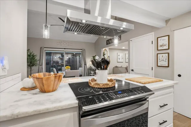 a kitchen with a table and chairs