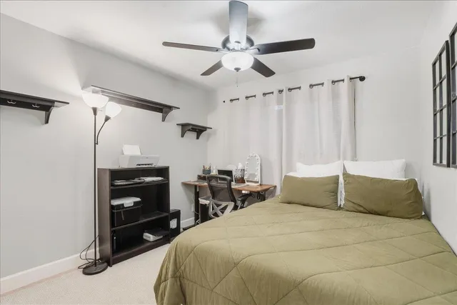 a bedroom with a bed and a dresser