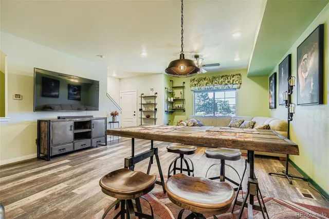 a kitchen with a table and chairs in it