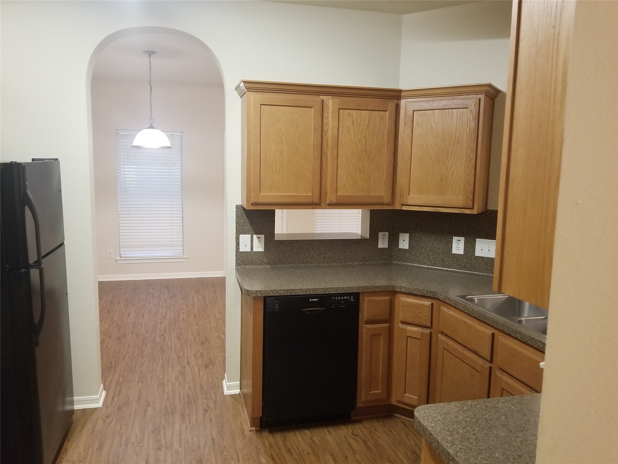 2406 Hawks Road Missouri City, TX 77489 - Photo 11 of 29 a kitchen with a sink and cabinets