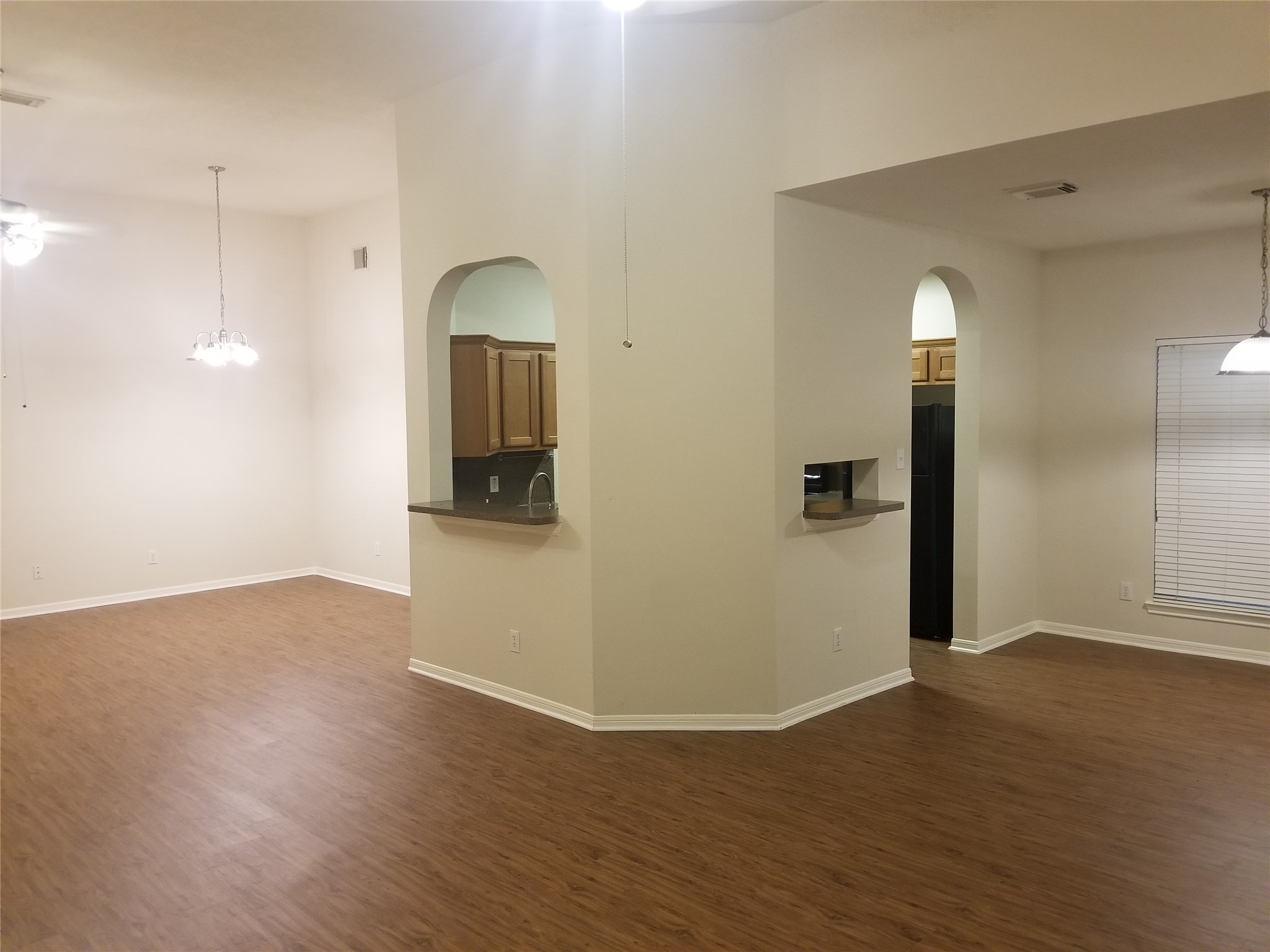 2406 Hawks Road Missouri City, TX 77489 - Photo 13 of 29 a view of empty room with wooden floor