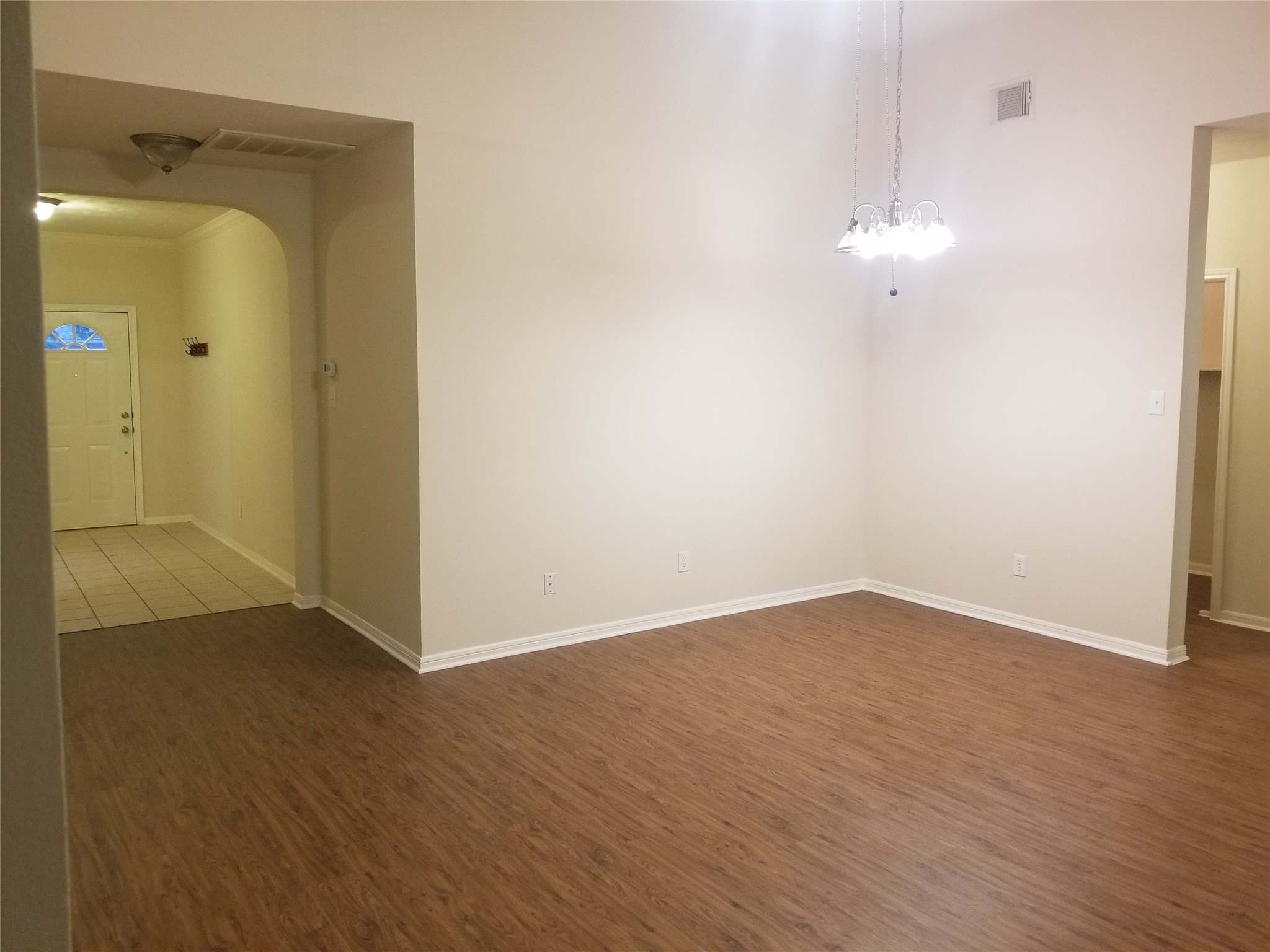 2406 Hawks Road Missouri City, TX 77489 - Photo 15 of 29 an empty room with wooden floor and mirror