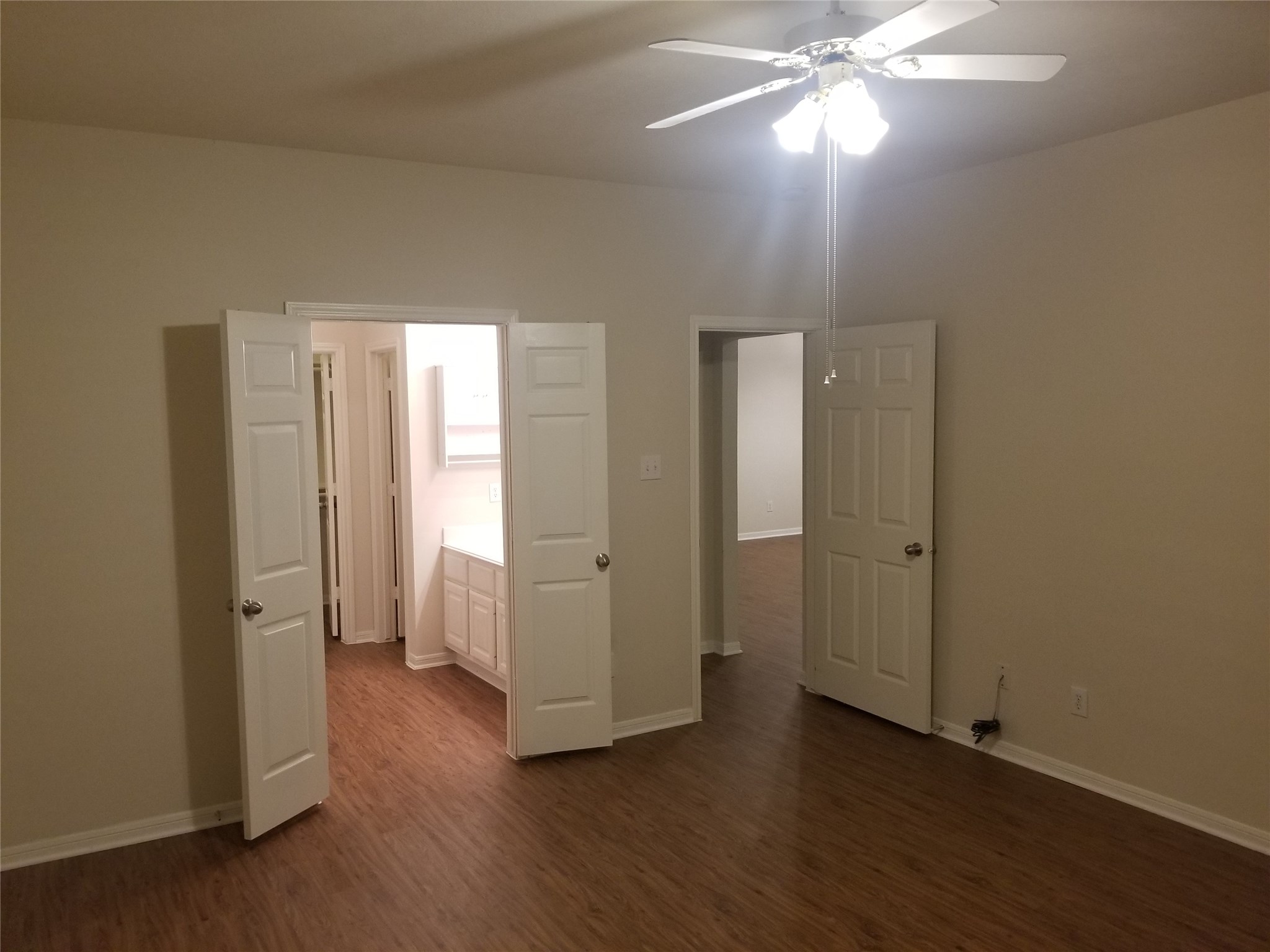2406 Hawks Road Missouri City, TX 77489 - Photo 22 of 29 an empty room with wooden floor and window