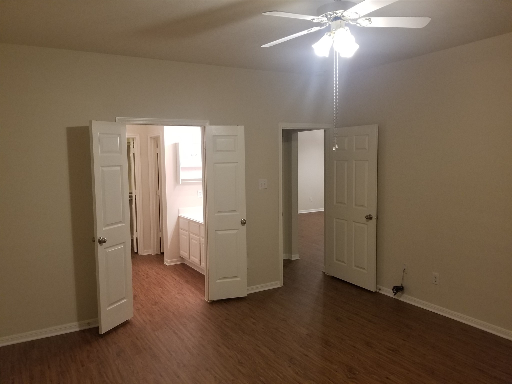 2406 Hawks Road Missouri City, TX 77489 - Photo 23 of 29 an empty room with wooden floor and window