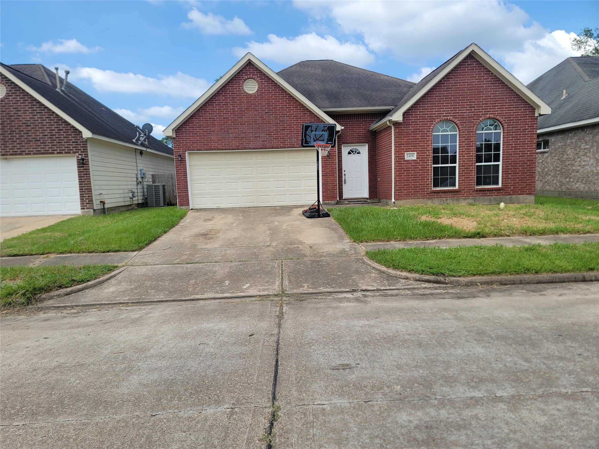 2406 Hawks Road Missouri City, TX 77489 - Photo 29 of 29 a front view of a house with a yard and garage