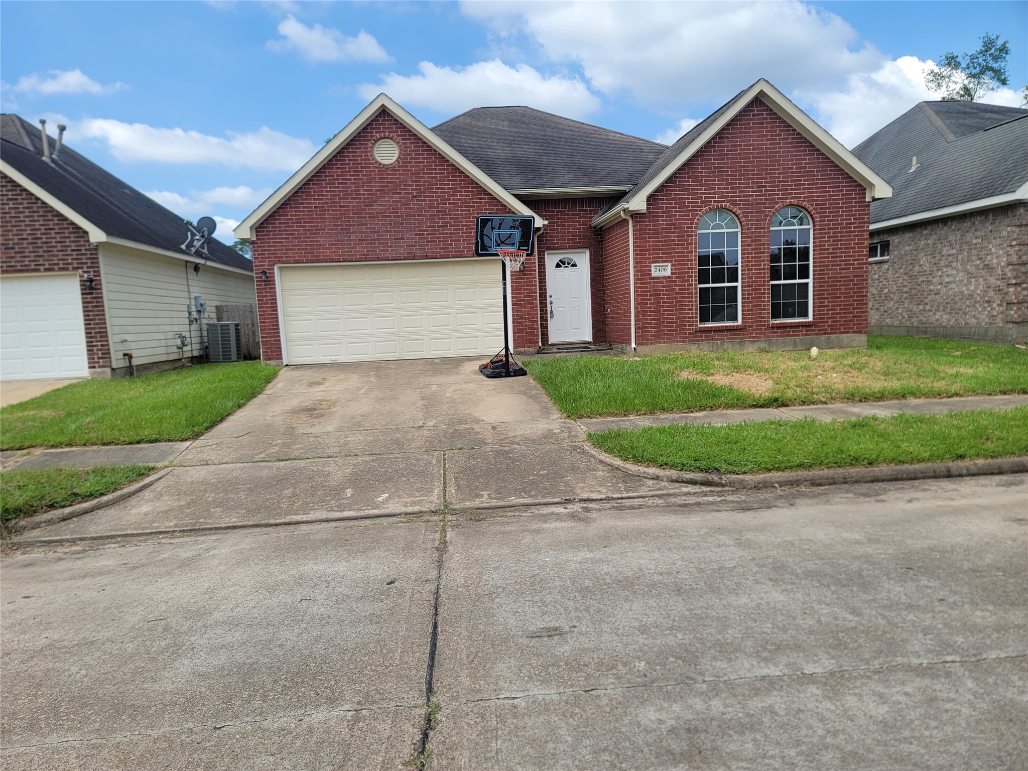 2406 Hawks Road Missouri City, TX 77489 - Photo 4 of 29 a front view of a house with a yard and garage
