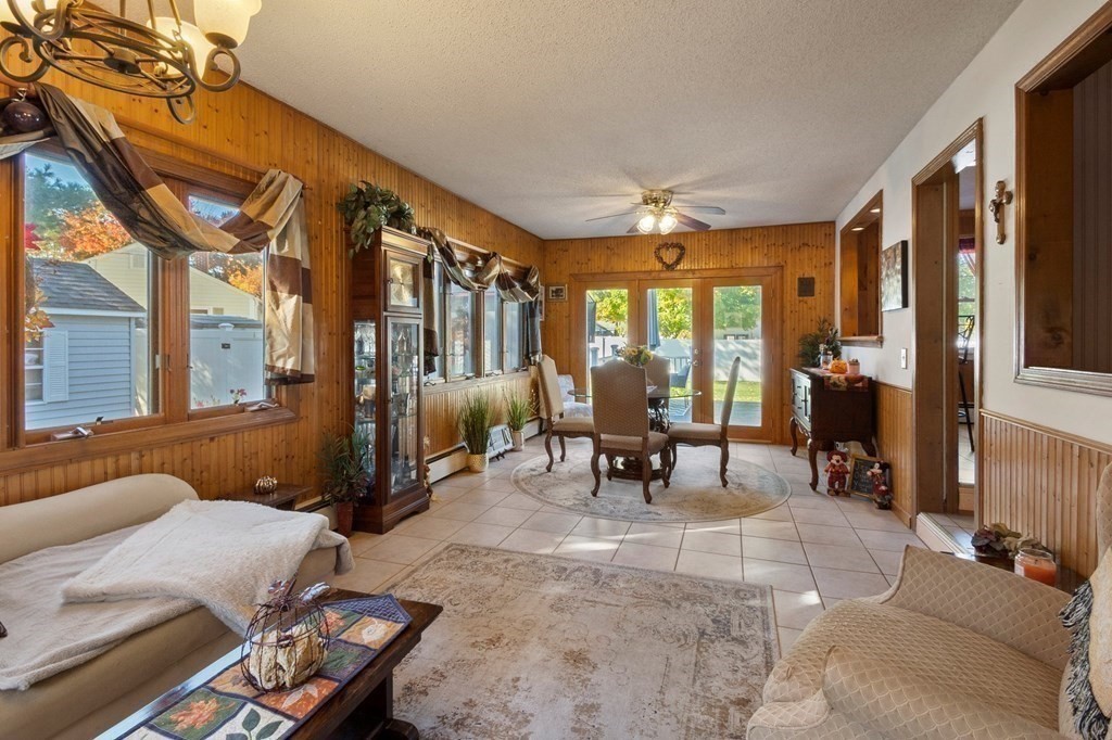 46 Timber Lane Springfield, MA 01119 - Photo 11 of 42 a living room with furniture a fireplace and large windows