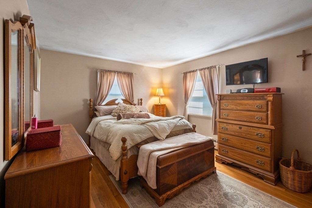 46 Timber Lane Springfield, MA 01119 - Photo 14 of 42 a bedroom with a bed and flat screen tv