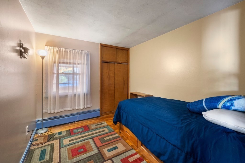 46 Timber Lane Springfield, MA 01119 - Photo 20 of 42 a bedroom with bed and balcony