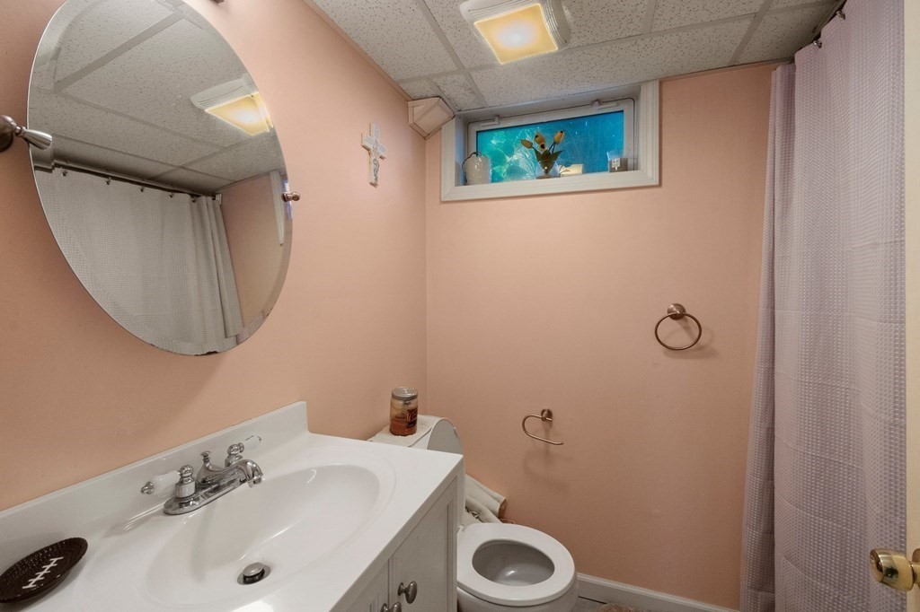 46 Timber Lane Springfield, MA 01119 - Photo 29 of 42 a bathroom with a sink mirror and toilet