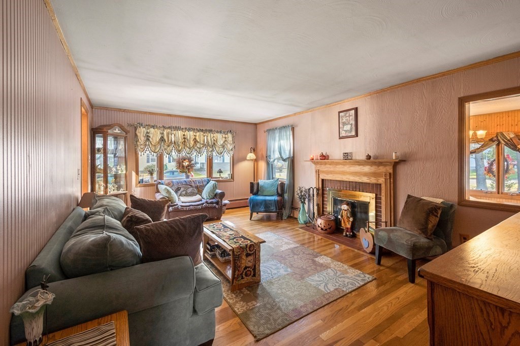 46 Timber Lane Springfield, MA 01119 - Photo 3 of 42 a living room with furniture and a fireplace