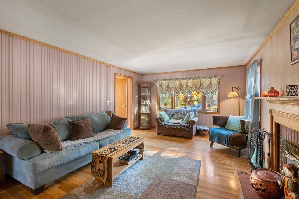 46 Timber Lane Springfield, MA 01119 - Photo 4 of 42 a living room with furniture and a fireplace