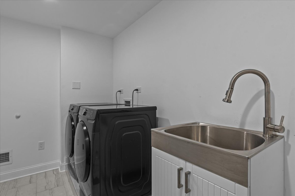 880 Willow Road Winnetka, IL 60093 - Photo 18 of 23 a close view of sink and tap