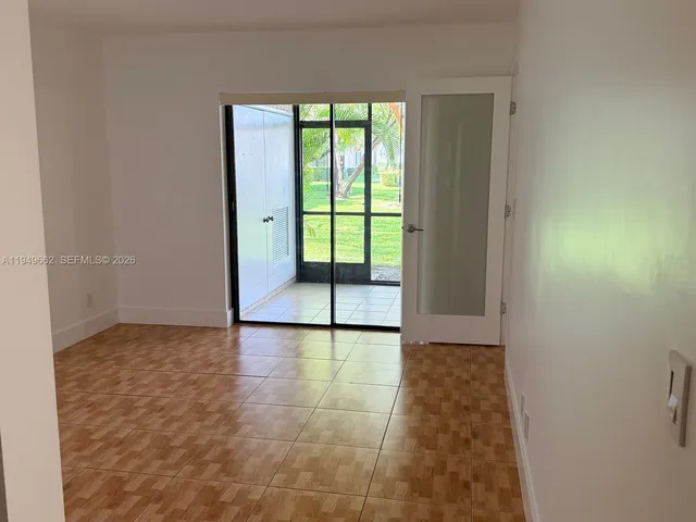 a view of a room with a large window