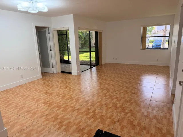 a kitchen with stainless steel appliances granite countertop a refrigerator stove a sink and dishwasher