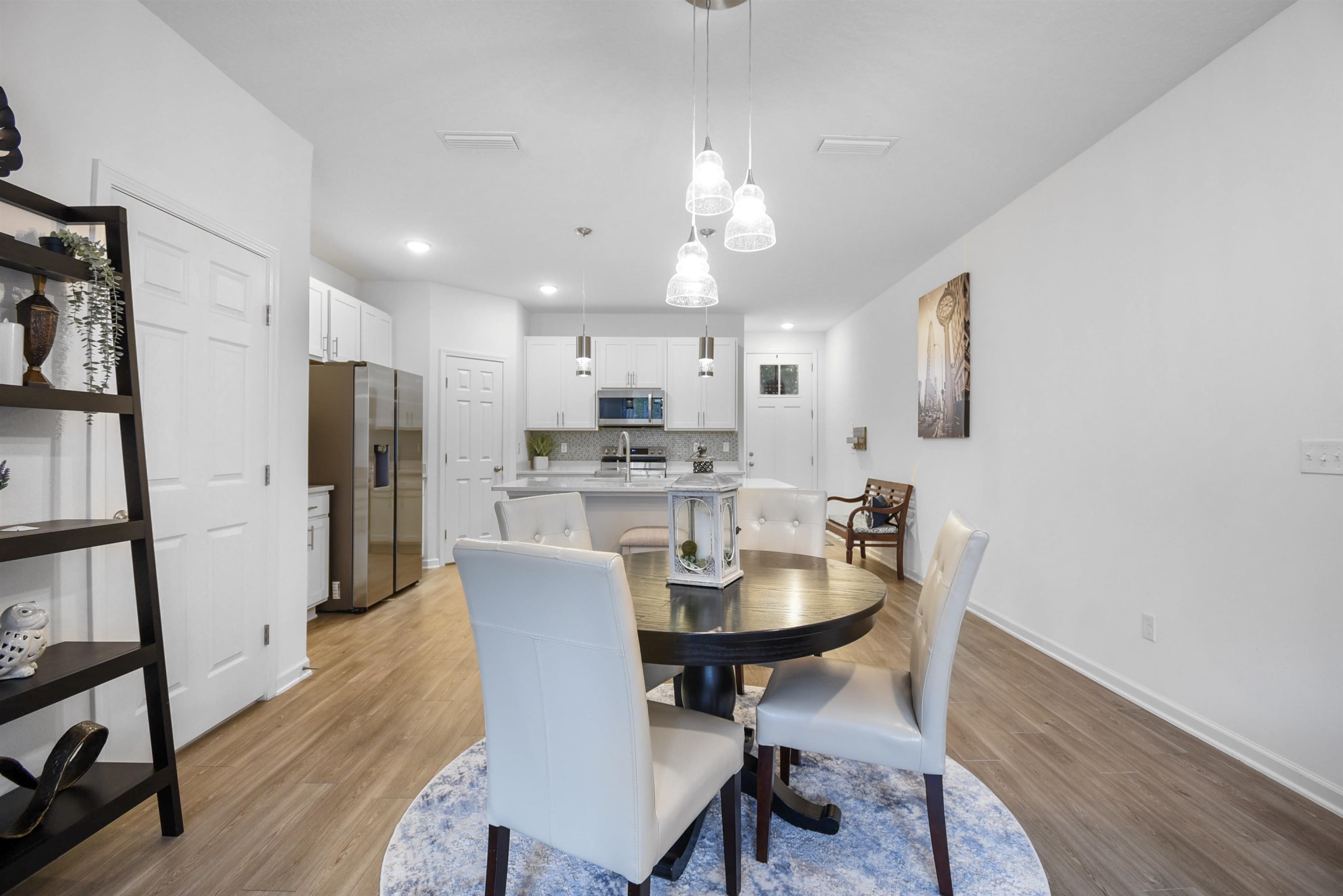 105 Ridge Lake Road St. Augustine, FL 32086 - Photo 11 of 34 a view of a dining room with furniture and wooden floor