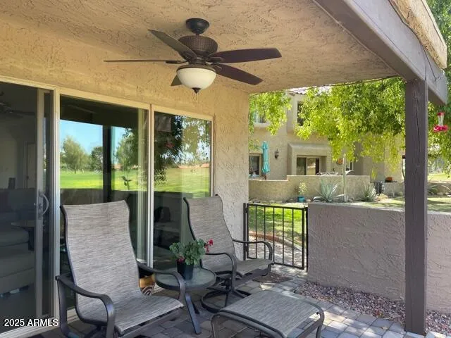 a view of a patio with table and chairs