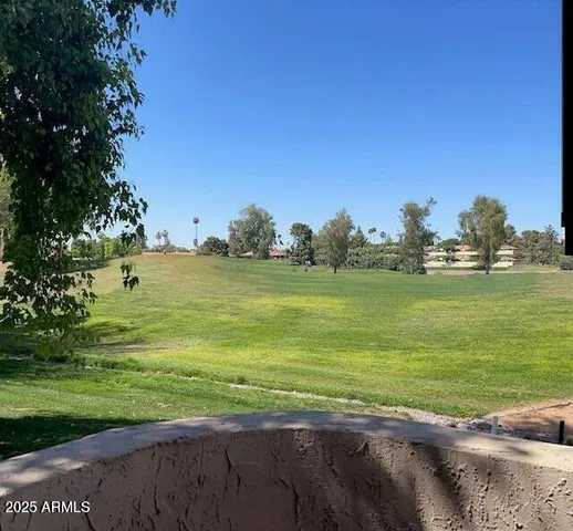 a view of a big yard with an outdoor space