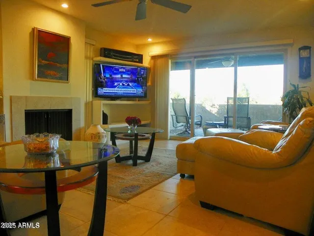 a outdoor living space with furniture and a fireplace