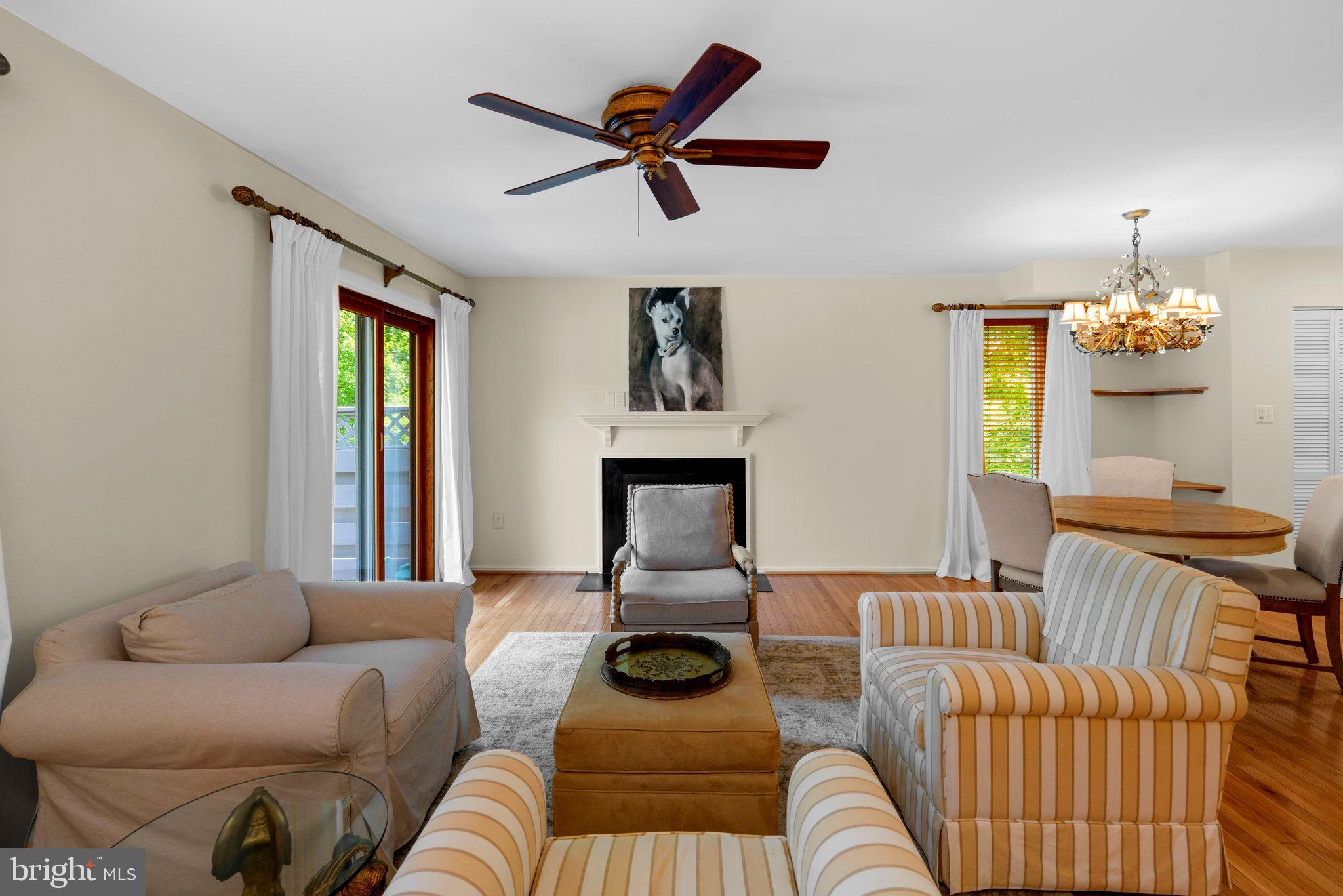 2 Stone Ridge Court Baltimore, MD 21239 - Photo 11 of 45 a living room with furniture and a chandelier