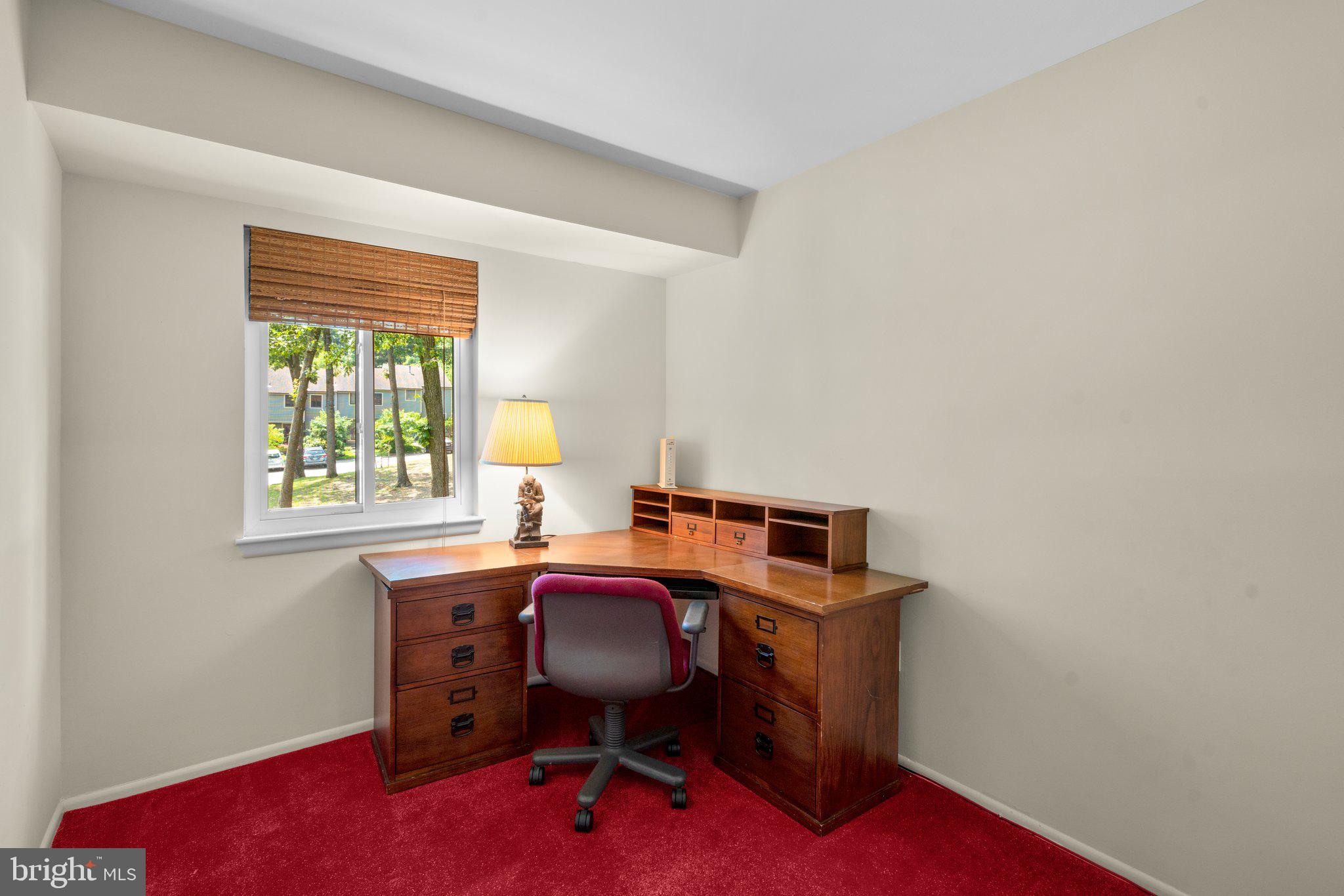 2 Stone Ridge Court Baltimore, MD 21239 - Photo 23 of 45 a view of a workspace with furniture and a window