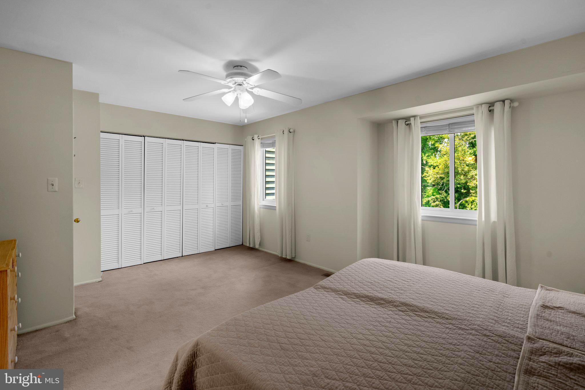 2 Stone Ridge Court Baltimore, MD 21239 - Photo 26 of 45 a bedroom with a large bed and a window
